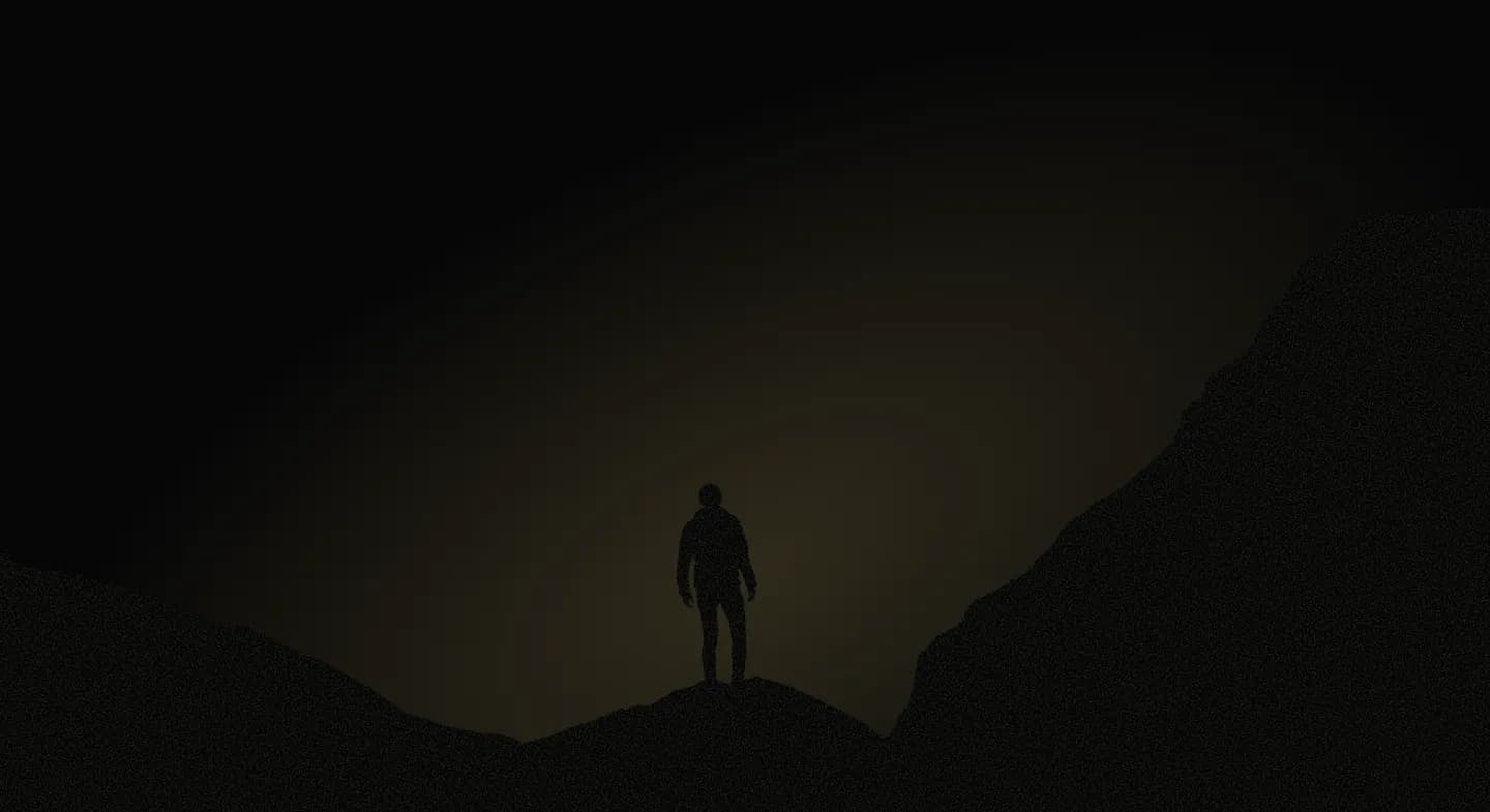 Silhouette on a mountain ridge at dusk